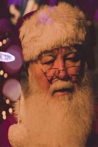 Santa in the glow of Christmas lights. He is checking his list and getting ready for the big night. Click here to view a 14 December Guilt Free Activities for After Knee Replacement to keep you busy while filling your cup! 