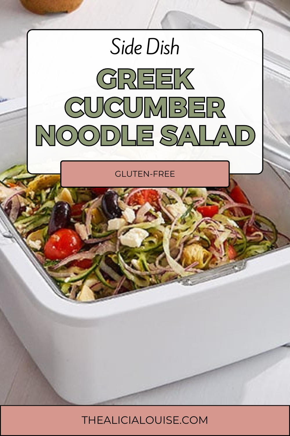 A vibrant bowl of Gluten-Free Greek Cucumber Noodle Salad featuring spiralized cucumber, cherry tomatoes, Kalamata olives, red onion, and feta cheese, all tossed in a tangy Greek dressing. Perfect for a quick, healthy meal.